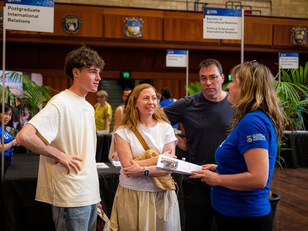 An adviser discussing course options with a student and family