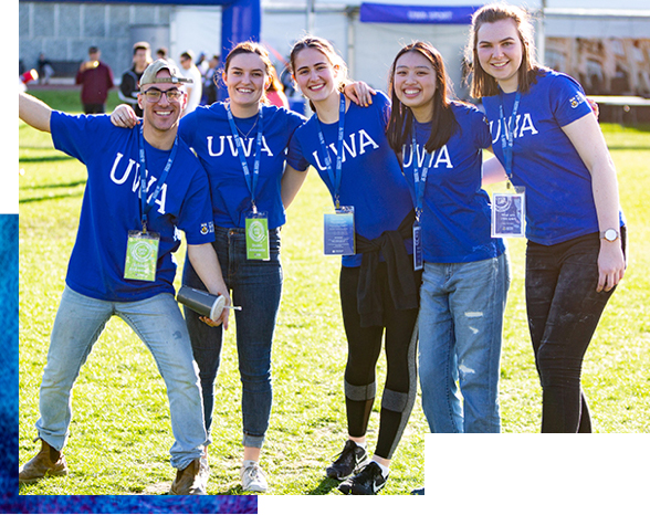 Group of smiling students wearing LIT shirts